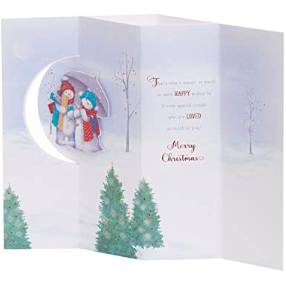 UK Greetings Christmas card for sister and brother-in-law featuring a snow couple design, ideal for holiday greeting purposes.
