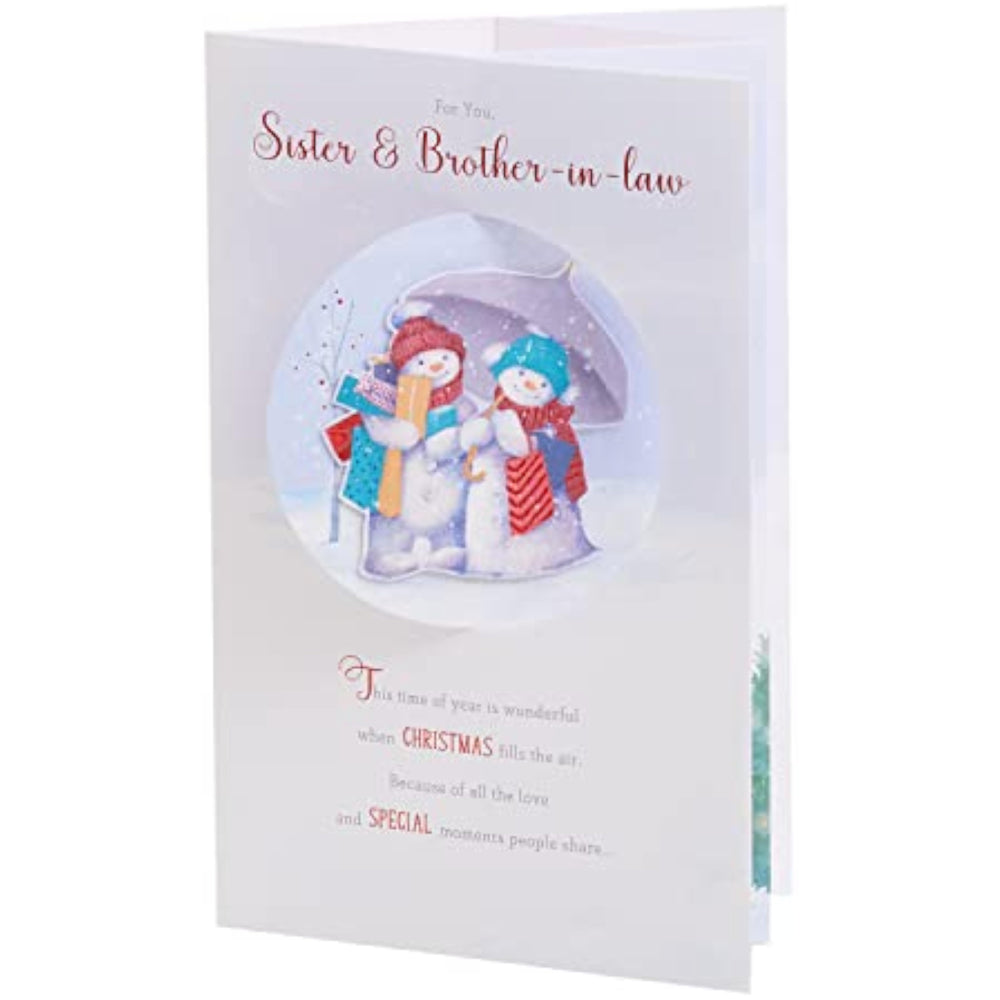 UK Greetings Christmas card featuring a snow couple design for sister and brother-in-law, with festive holiday imagery.