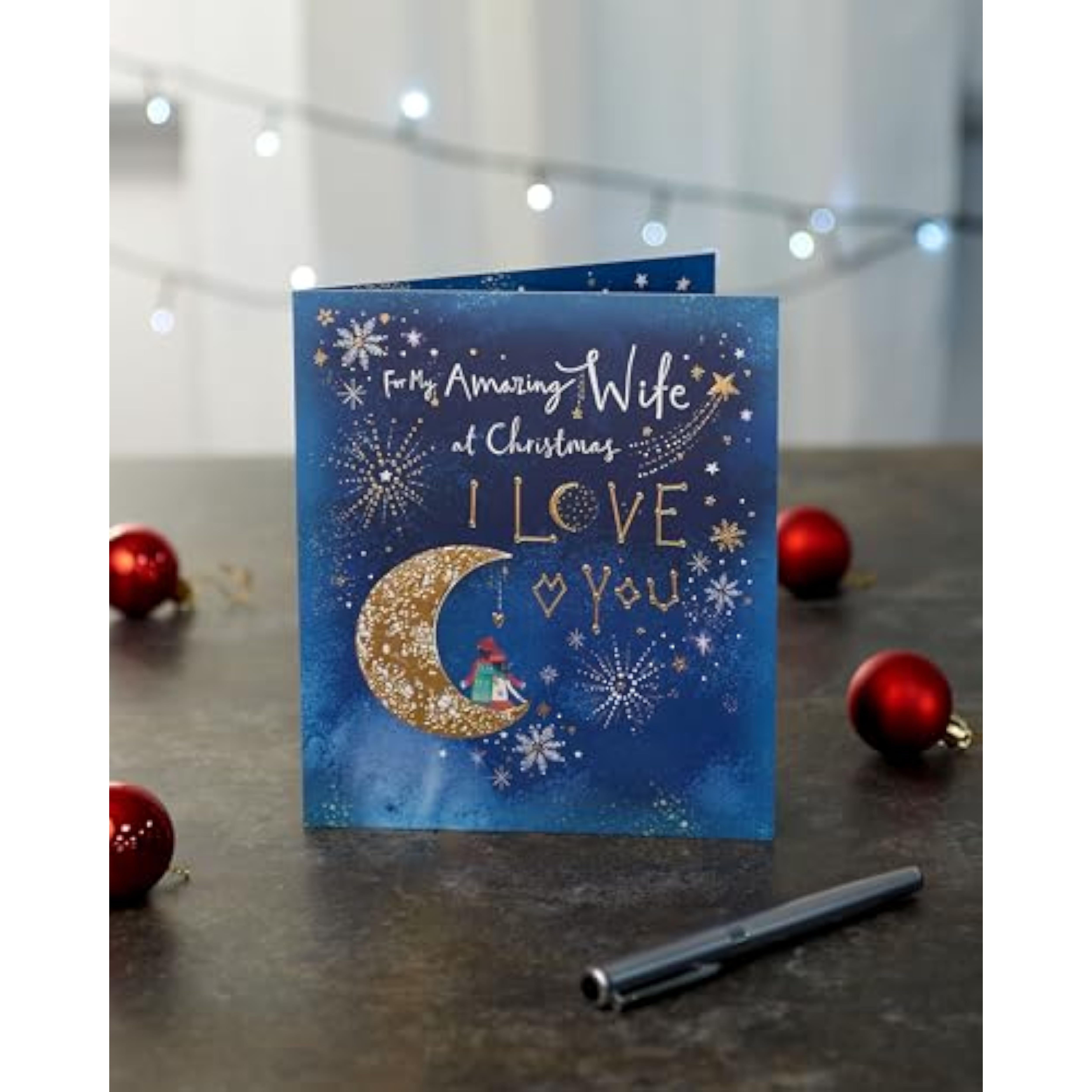 UK Greetings Christmas card for wife featuring a moon design, festive greeting card from the UK Greetings brand.