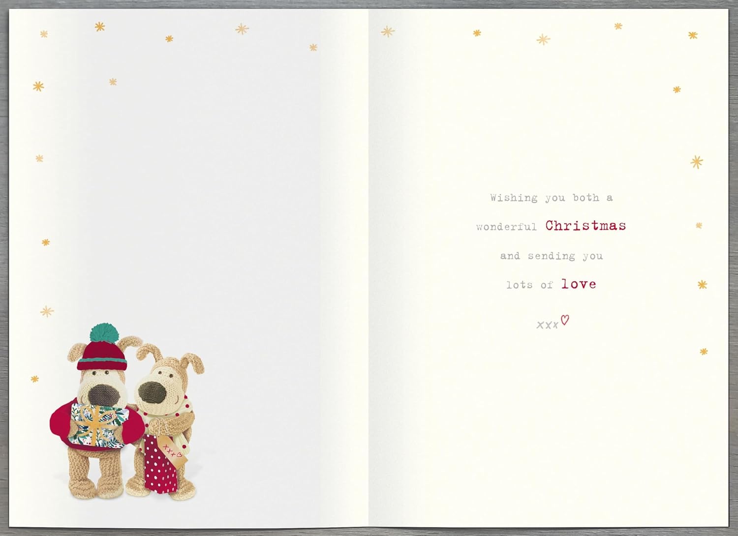 UK Greetings Christmas greeting card featuring cute Boofle holding gifts, with festive design for daughter and partner.