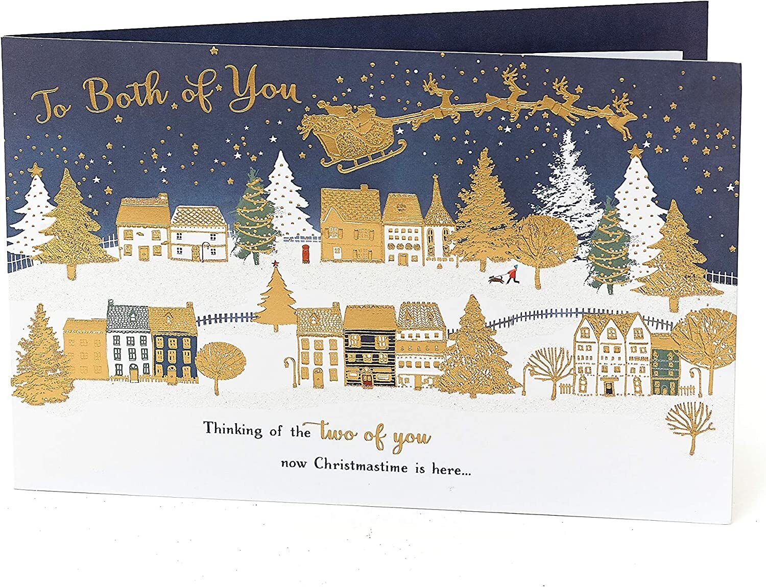 UK Greetings Christmas Town Scene greeting card showing festive holiday scene with a snowy town and holiday decorations.