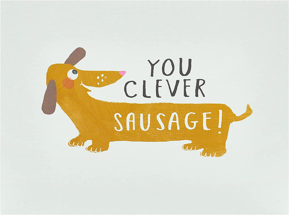 UK Greetings Clever Sausage Congratulations humorous greeting card with "Well Done You!" message and playful sausage illustration.
