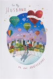 Colorful hot air balloon design on UK Greetings anniversary card for husband, featuring vibrant artwork and heartfelt message.