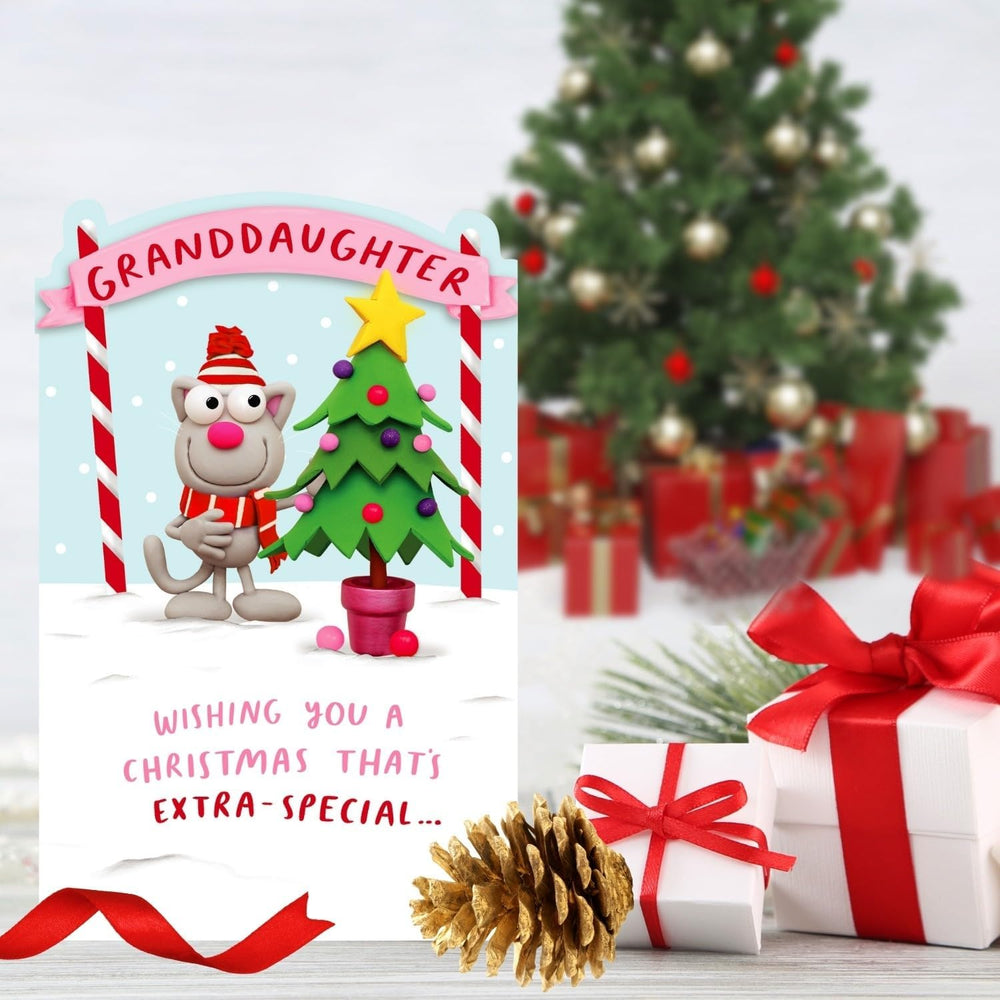 UK Greetings Crackers Extra Granddaughter funny cat Christmas greeting card with festive design and holiday message.
