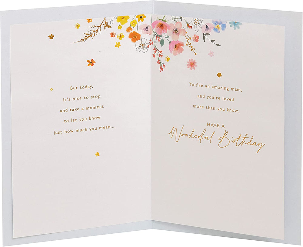 UK Greetings Mam birthday card featuring watercolour floral hearts and cute design, perfect for celebrating special occasions.