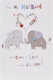 UK Greetings cute elephant husband birthday card with "Tons of Love" message, featuring colorful elephant illustration and festive design