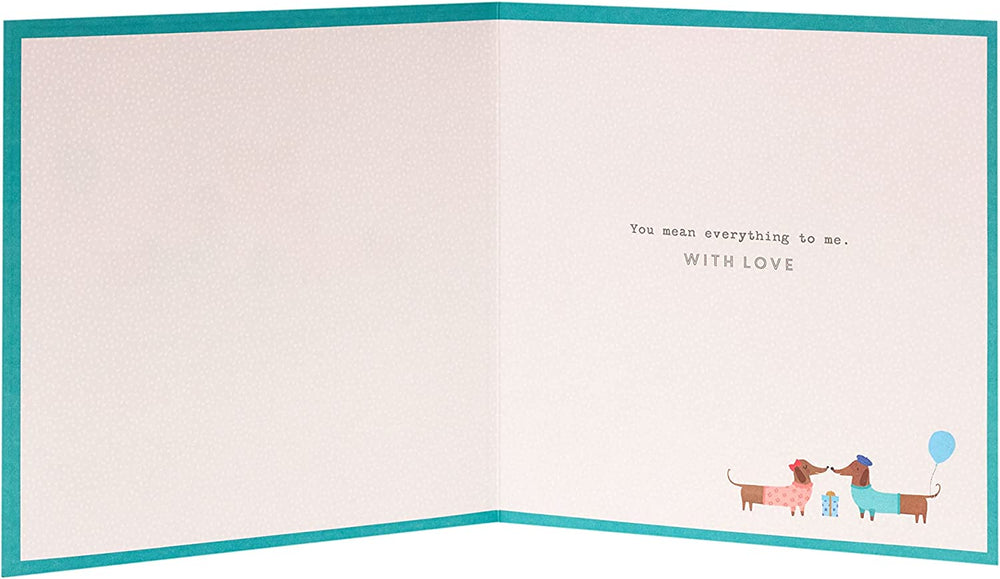 UK Greetings cute sausage dog birthday card featuring a charming design for husbands, perfect for celebrating special occasions.