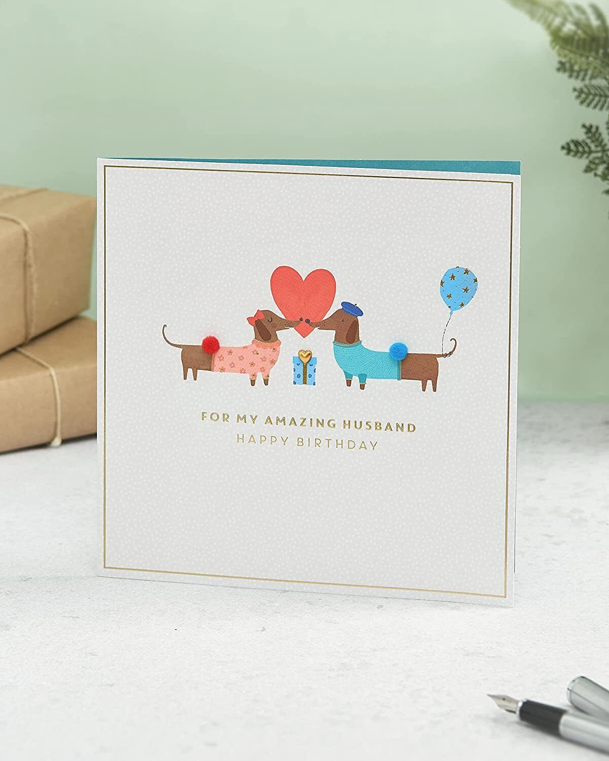 UK Greetings cute sausage dog design husband birthday card featuring charming dog illustration and heartfelt birthday message