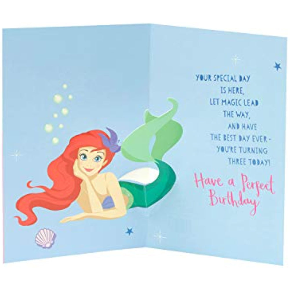 UK Greetings Disney Princess birthday card for age 3 featuring Snow White, Belle, and Ariel with colorful princess illustrations.