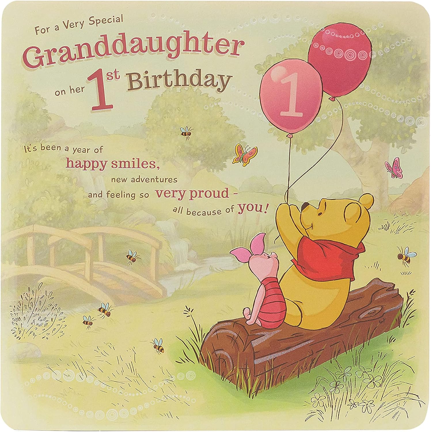 UK Greetings Disney Winnie the Pooh 1st Granddaughter birthday card with colorful Pooh illustration and cheerful message.