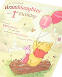 UK Greetings Disney Winnie the Pooh 1st Granddaughter birthday card with colorful Pooh illustration and cheerful message inside.