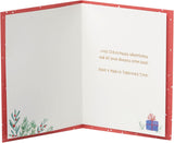Disney Winnie the Pooh Christmas card by UK Greetings featuring Pooh and friends in a festive holiday scene.