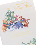 Disney Winnie the Pooh Christmas card by UK Greetings featuring Pooh and friends, with festive holiday design and cheerful characters.