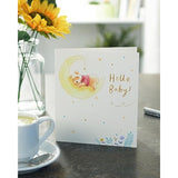 UK Greetings Disney Winnie the Pooh new baby greeting card featuring Winnie the Pooh and friends in soft pastel colors.