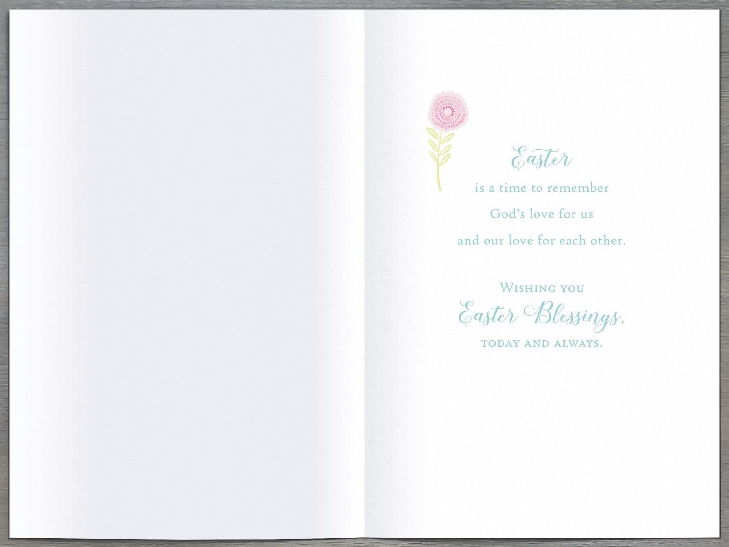 UK Greetings Easter Card featuring a cross and flowers with the message "The Lord Has Risen," decorative religious greeting card.