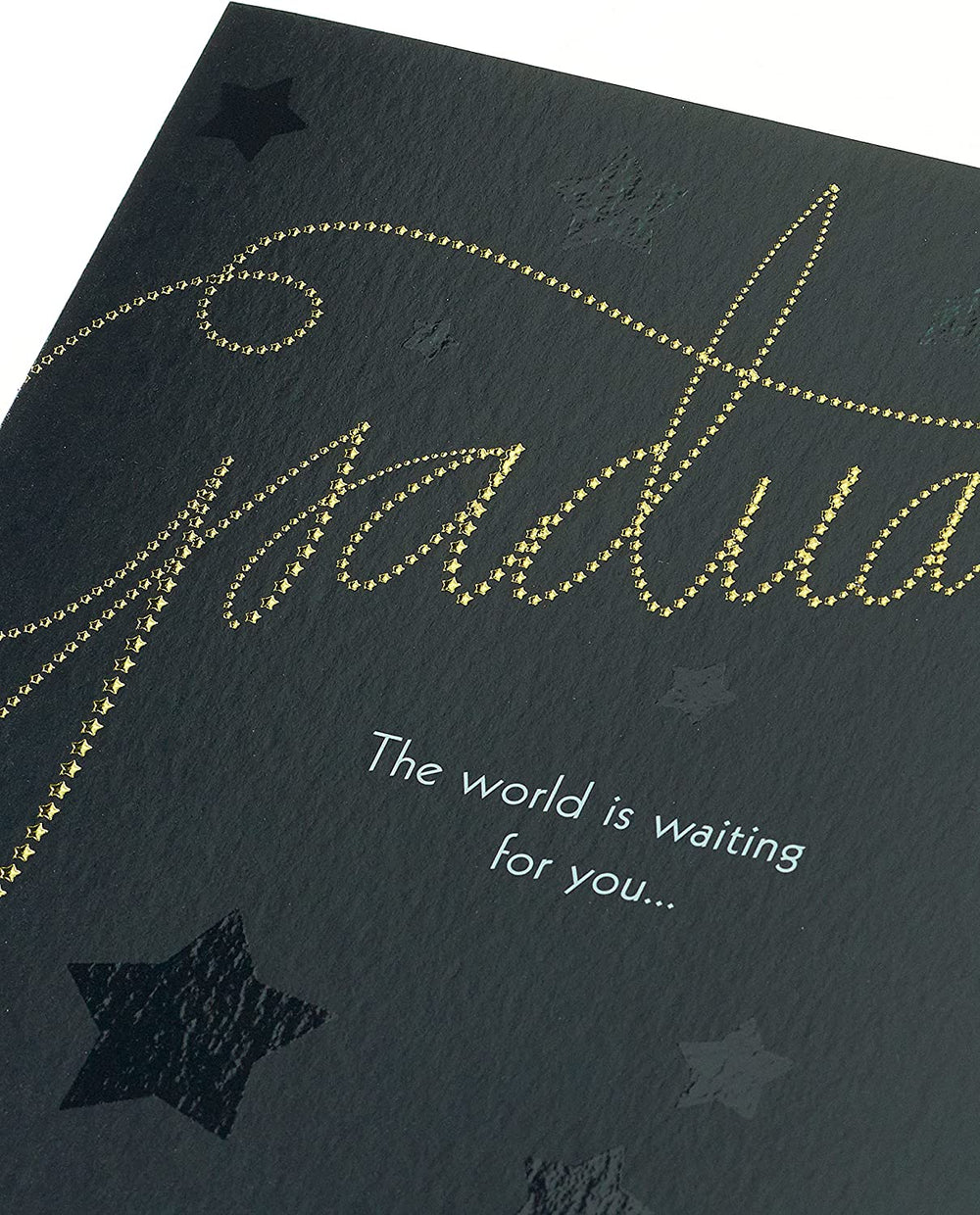 UK Greetings elegant graduation card with foil and embossed finish, featuring a celebratory design on the front.