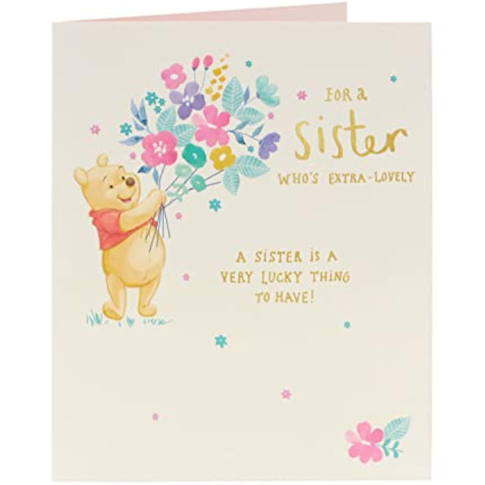 UK Greetings Winnie the Pooh birthday card featuring flowers, designed for sisters, with Disney Winnie the Pooh illustration.