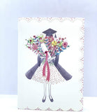 UK Greetings glitter and diamanté graduation card featuring a girl with flowers, perfect for celebrating graduations.
