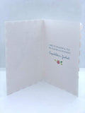 UK Greetings glitter and diamante graduation card featuring a girl with flowers, decorative and festive greeting card design.