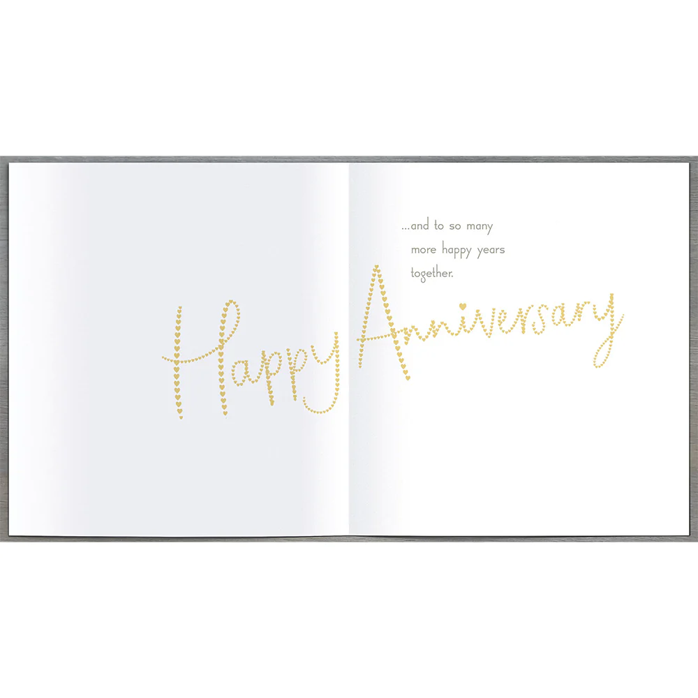 UK Greetings anniversary greeting card for husband, featuring heartfelt message and decorative design for special occasion.