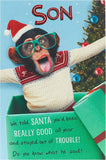 UK Greetings funny cheeky champ design Christmas card for son, featuring humorous holiday greeting and festive imagery.