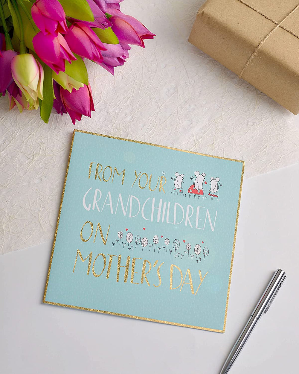 UK Greetings Mother's Day greeting card featuring a heartfelt message from grandchildren, with floral and cheerful design elements.