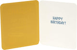 UK Greetings humorous birthday card for husband, featuring funny illustrations and lighthearted message in a greeting card format.