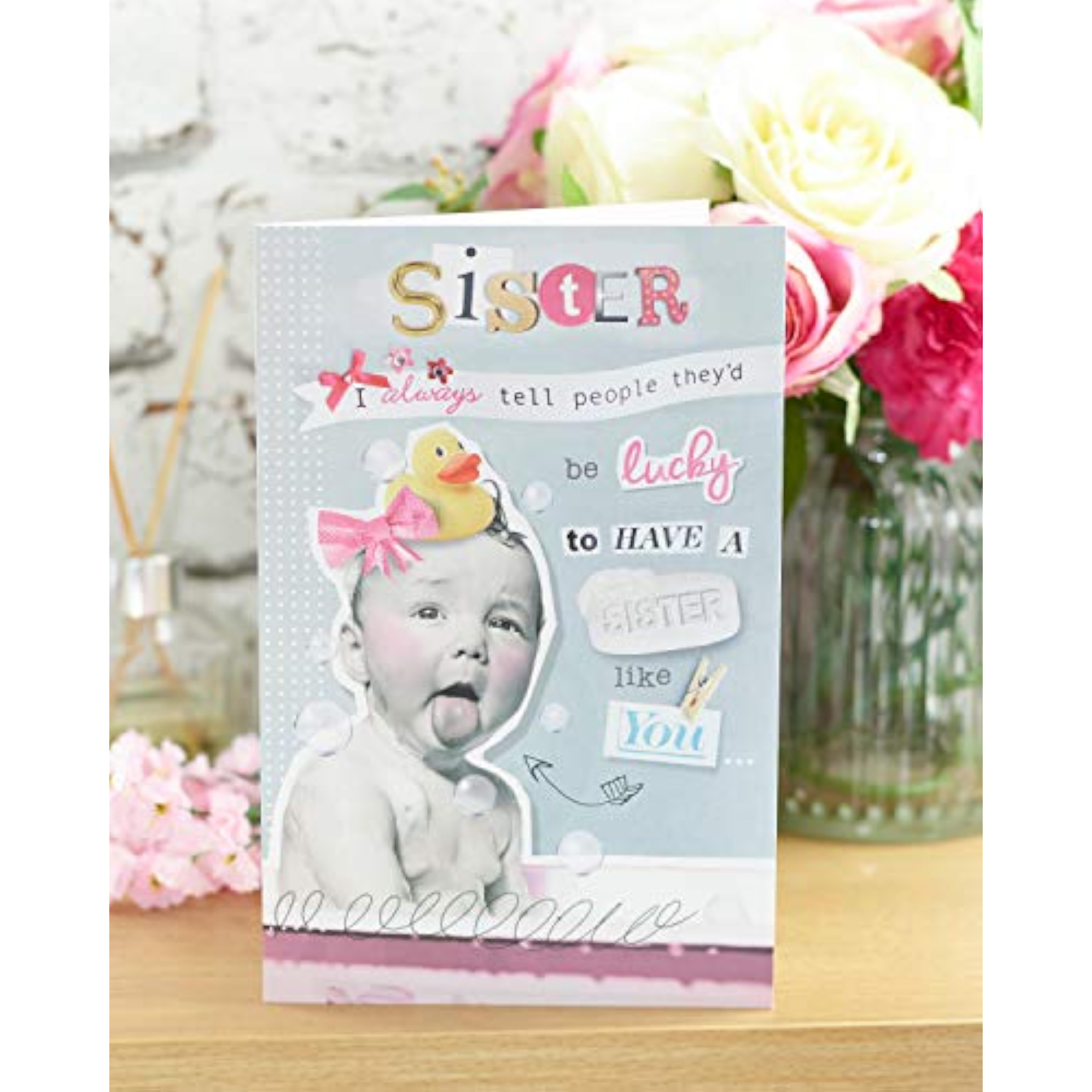 UK Greetings funny design sister birthday greeting card with colorful illustrations and playful typography.