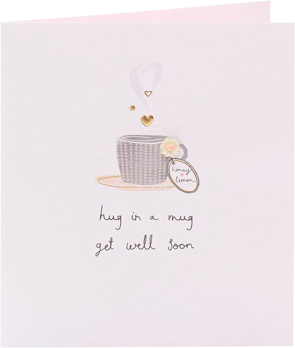 UK Greetings Get Well Soon handmade greeting card featuring a cozy mug with a hug illustration, perfect for sending warm wishes.