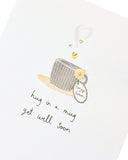 UK Greetings Get Well Soon handmade greeting card featuring a cozy hug in a mug design, perfect for sending warm wishes.