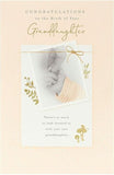 UK Greetings gold foil greeting card celebrating a new granddaughter with congratulatory message and decorative design.