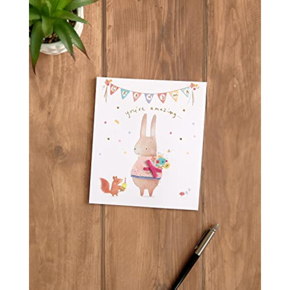 UK Greetings grandma birthday greeting card with envelope featuring a cute rabbit design and colorful illustrations.