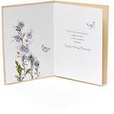 UK Greetings birthday greeting card showing colorful birthday message with decorative floral design.