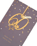UK Greetings Happy 60th Birthday greeting card with hanging keepsake, featuring colorful birthday design and decorative elements.