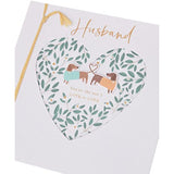 UK Greetings romantic greeting card for husband featuring a pair of playful sausage dogs in a charming design.