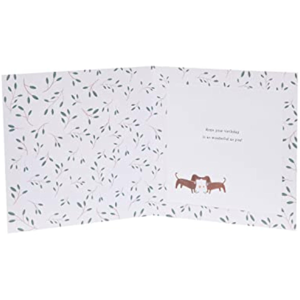 UK Greetings romantic greeting card for husband featuring a playful pair of sausage dogs illustration.