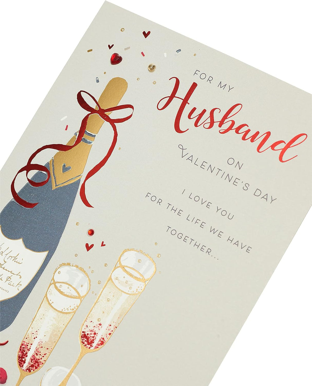 UK Greetings husband Valentine's Day card with champagne design and envelope, featuring romantic greeting and elegant artwork.