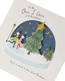 UK Greetings romantic Christmas greeting card featuring ice skaters inside a snow globe, perfect for conveying love during the holiday season.