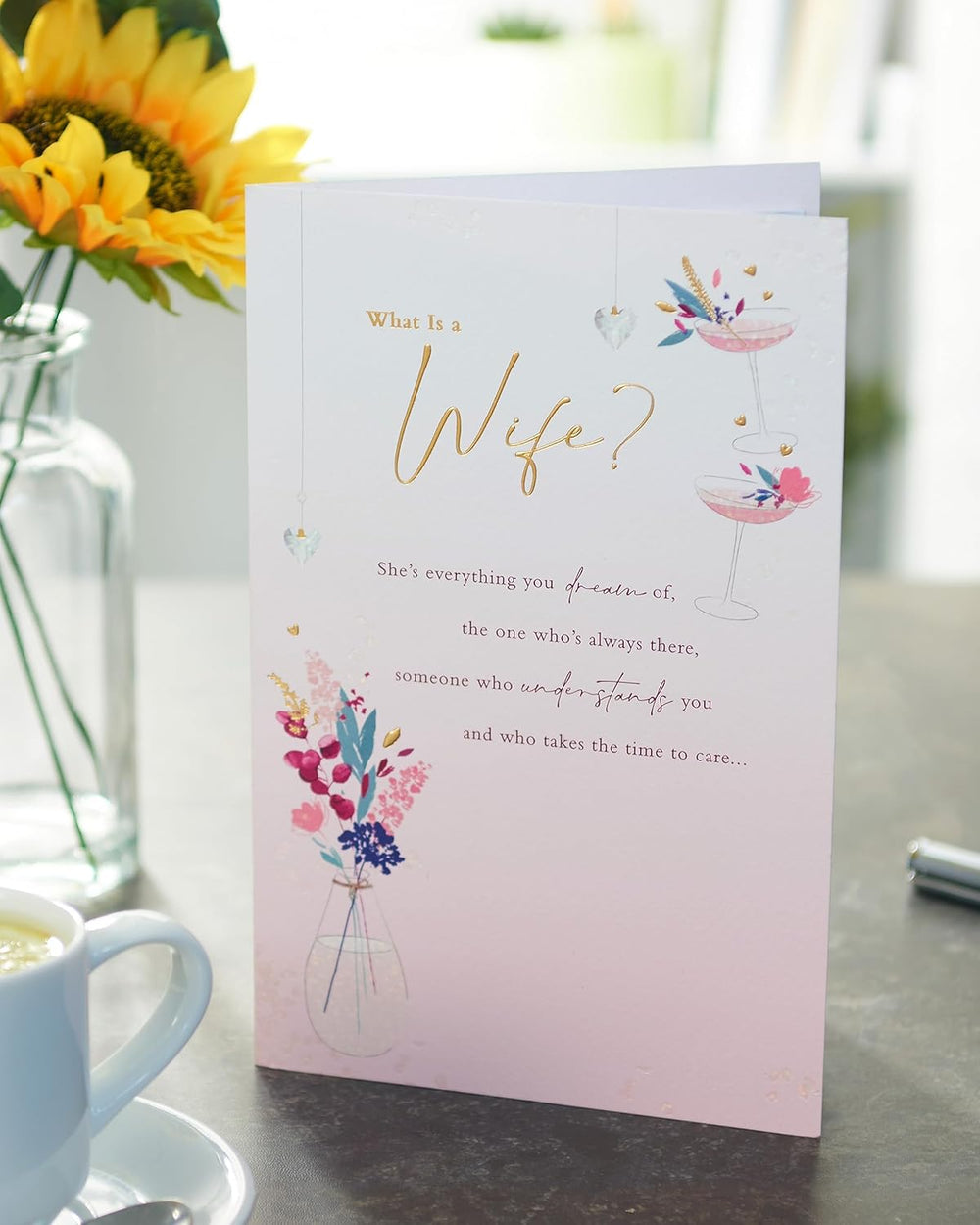 UK Greetings integrated greeting card featuring an open design with "What Is a Wife" message, ideal for special occasions.
