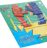 UK Greetings interactive Rock 'Em Sock 'Em design son birthday card featuring colorful, fun illustrations for kids' celebration.