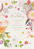 UK Greetings Into the Meadow greeting card featuring a cute floral design with colorful flowers and greenery.