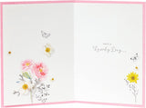 UK Greetings Into the Meadow greeting card with a cute floral design, featuring colorful flowers and nature-inspired artwork.