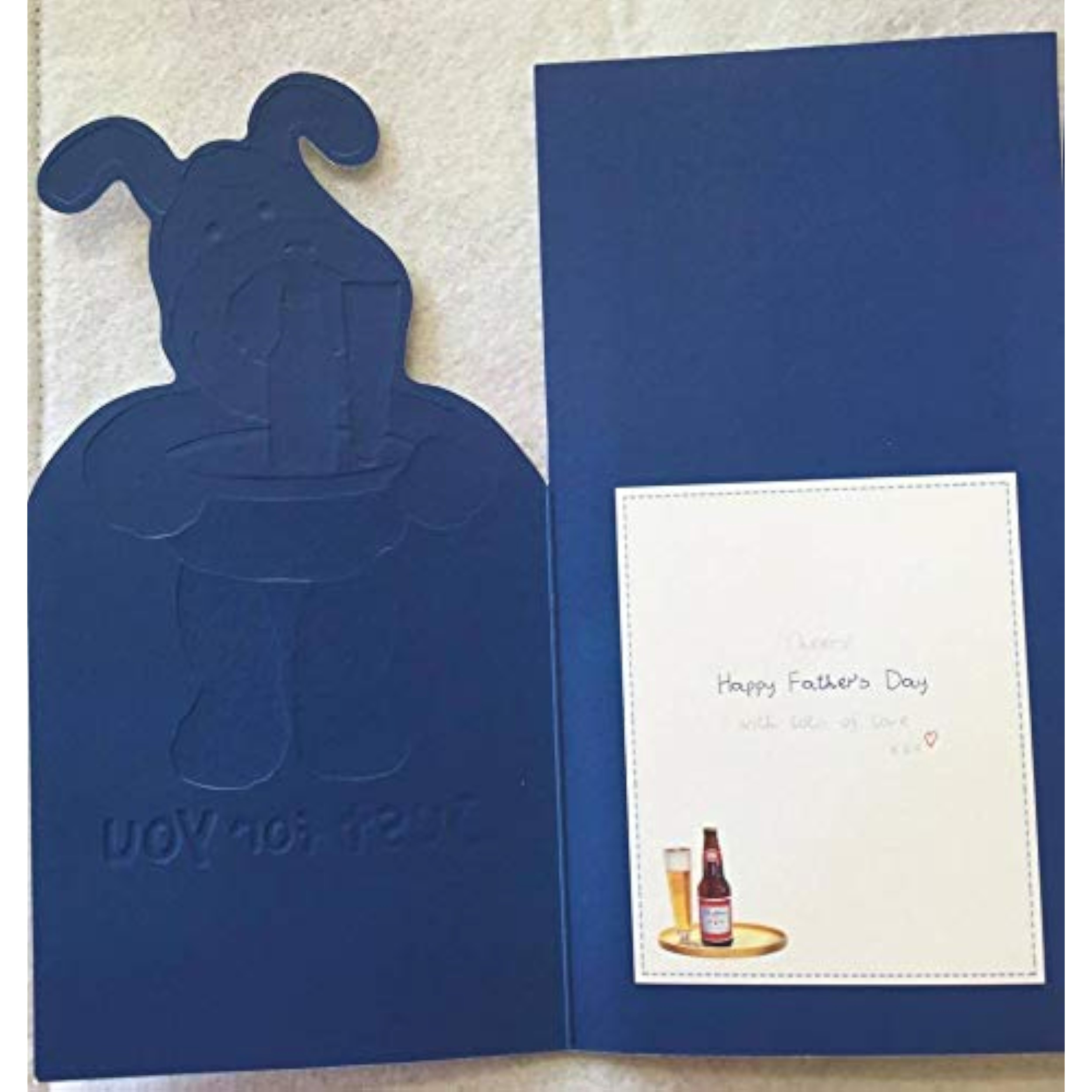 Open UK Greetings Boofle Happy Father's Day card featuring colorful illustrations and heartfelt message for anyone.