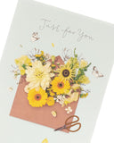 UK Greetings floral design birthday card featuring colorful flowers and elegant lettering, perfect for celebrating special occasions.