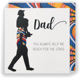 UK Greetings Kindred X Afrotouch birthday card titled "Reach for the Stars Dad" with colorful star and space-themed design.