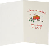 UK Greetings Christmas card featuring holly with berries, designed for son and daughter-in-law, festive greeting card image.