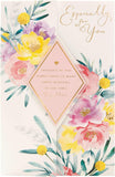 UK Greetings Mother's Day card with envelope featuring a beautiful floral design, perfect for celebrating mothers.