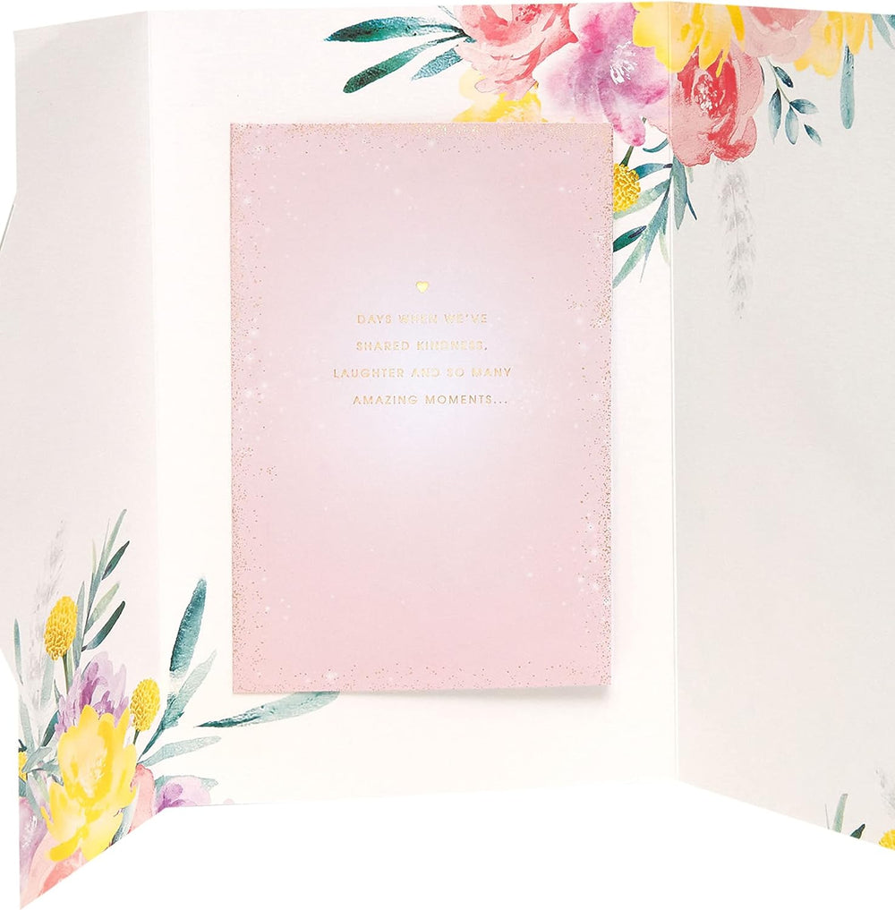 UK Greetings Mother's Day card with envelope featuring a beautiful floral design, perfect for celebrating moms.