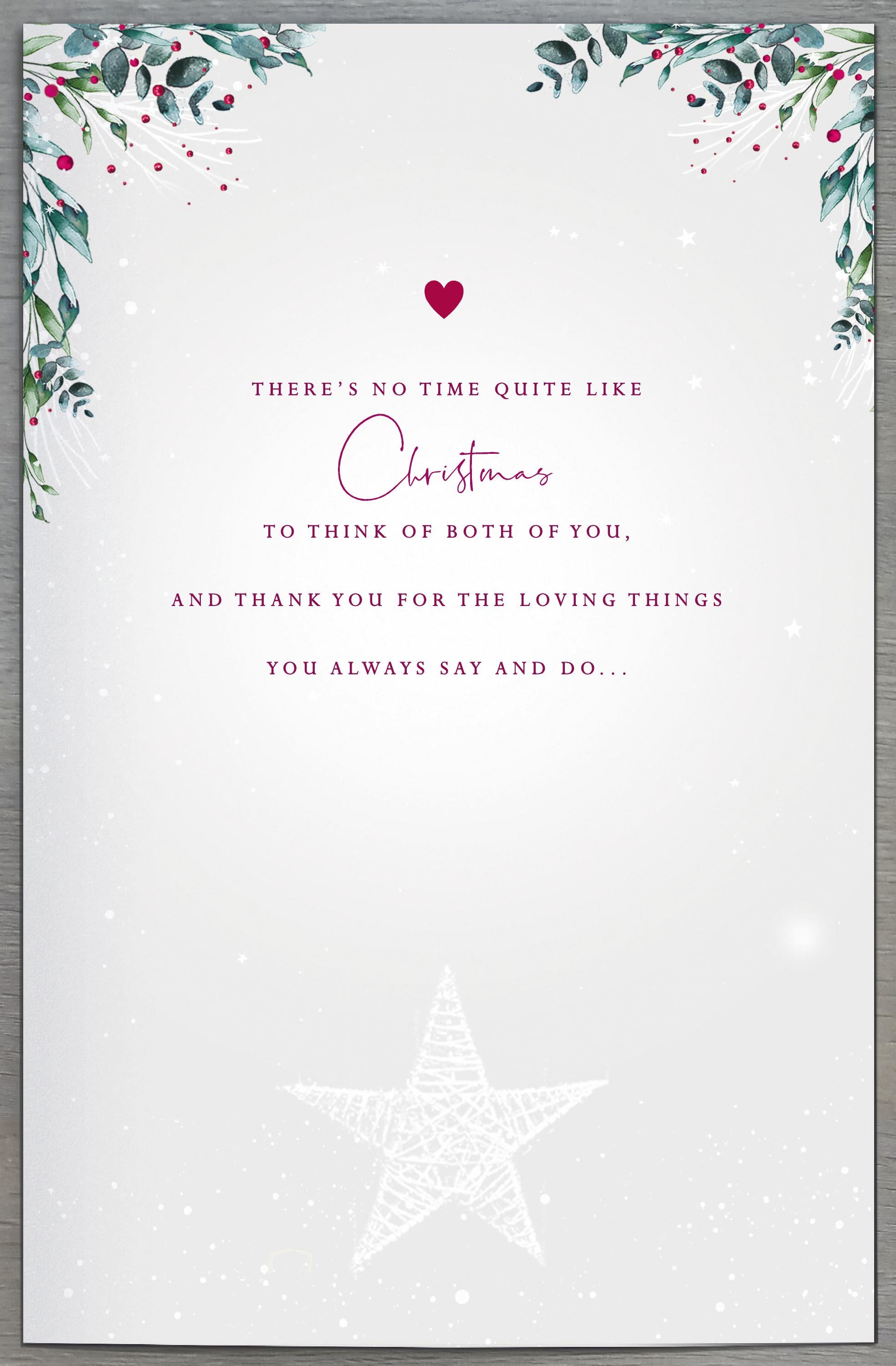 UK Greetings Mum and Dad fireplace Christmas greeting card with festive holiday design and heartfelt message.