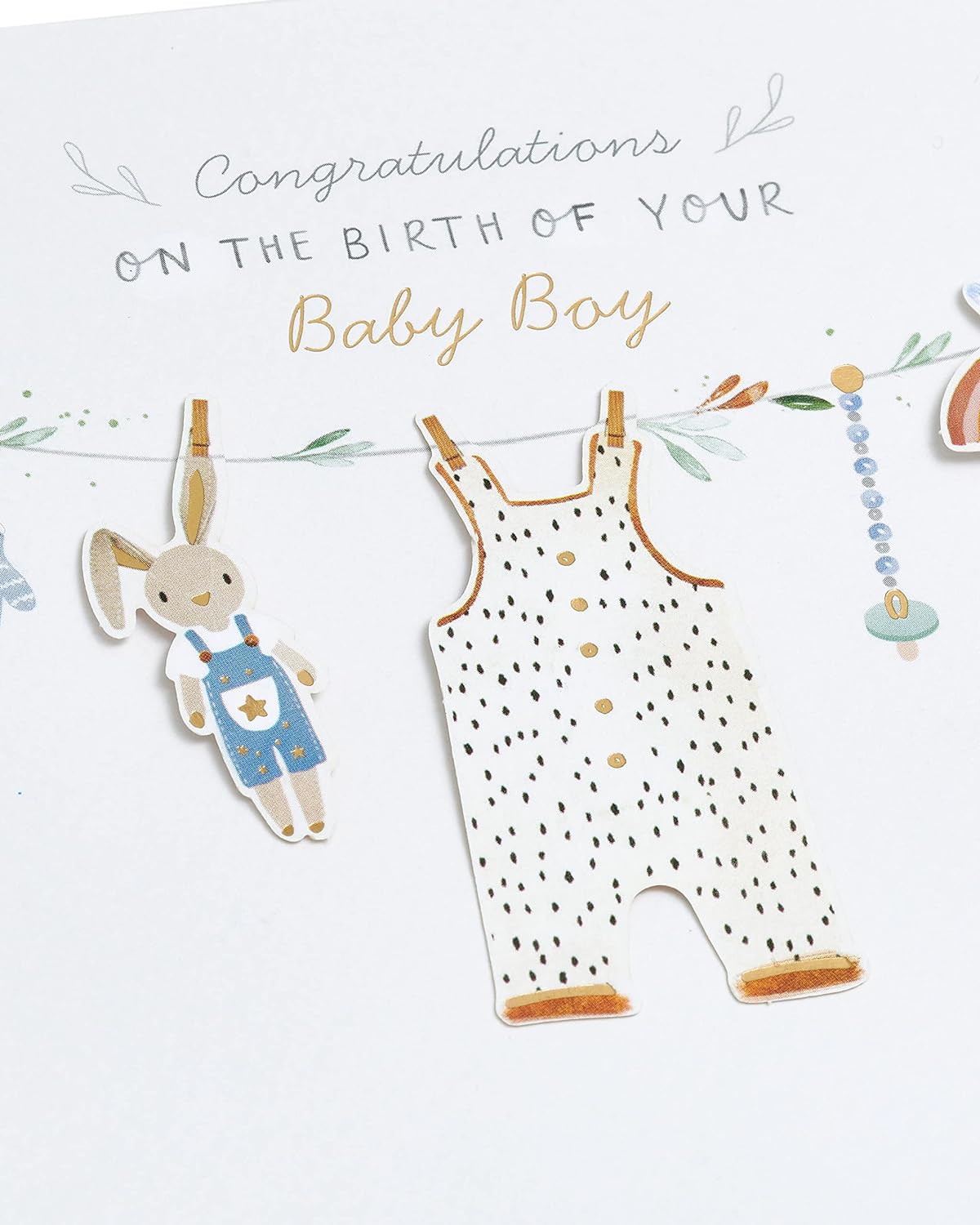 UK Greetings New Baby Boy greeting card with washing line design, featuring adorable baby-themed illustrations on the front.